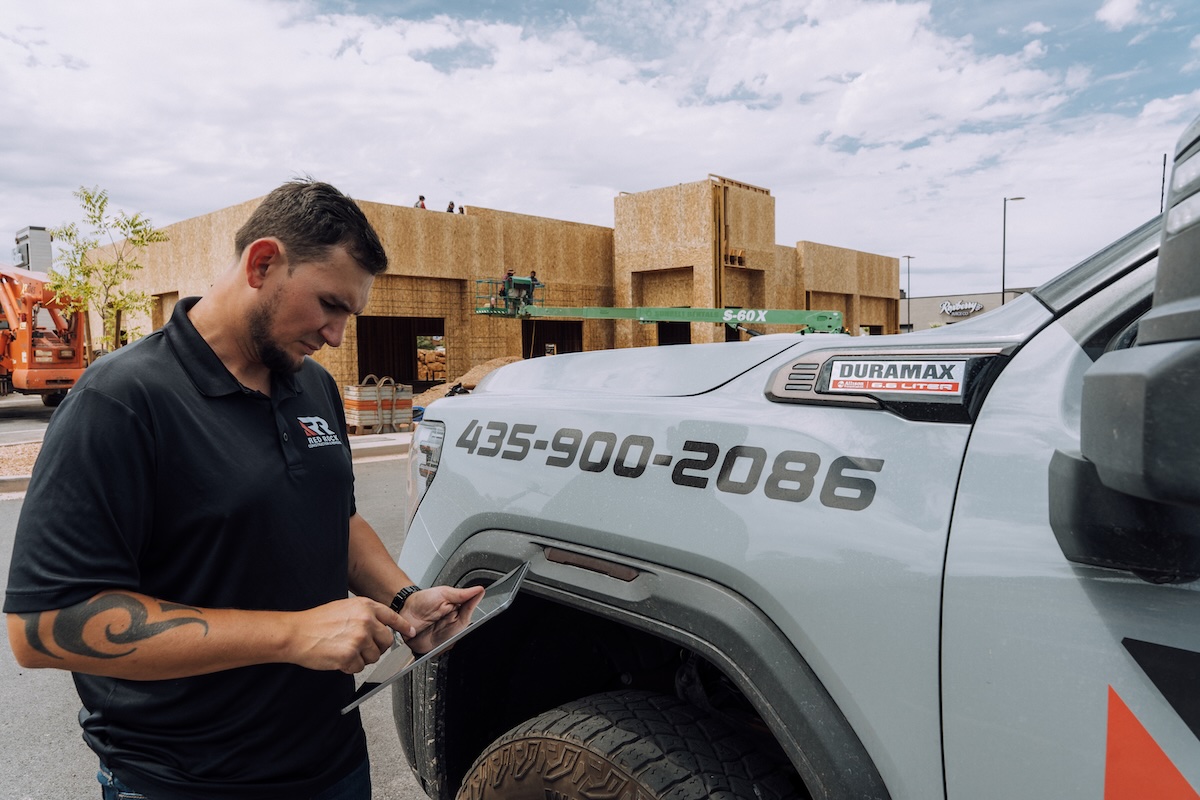 image of contractor reviewing job site for residential remodeling services